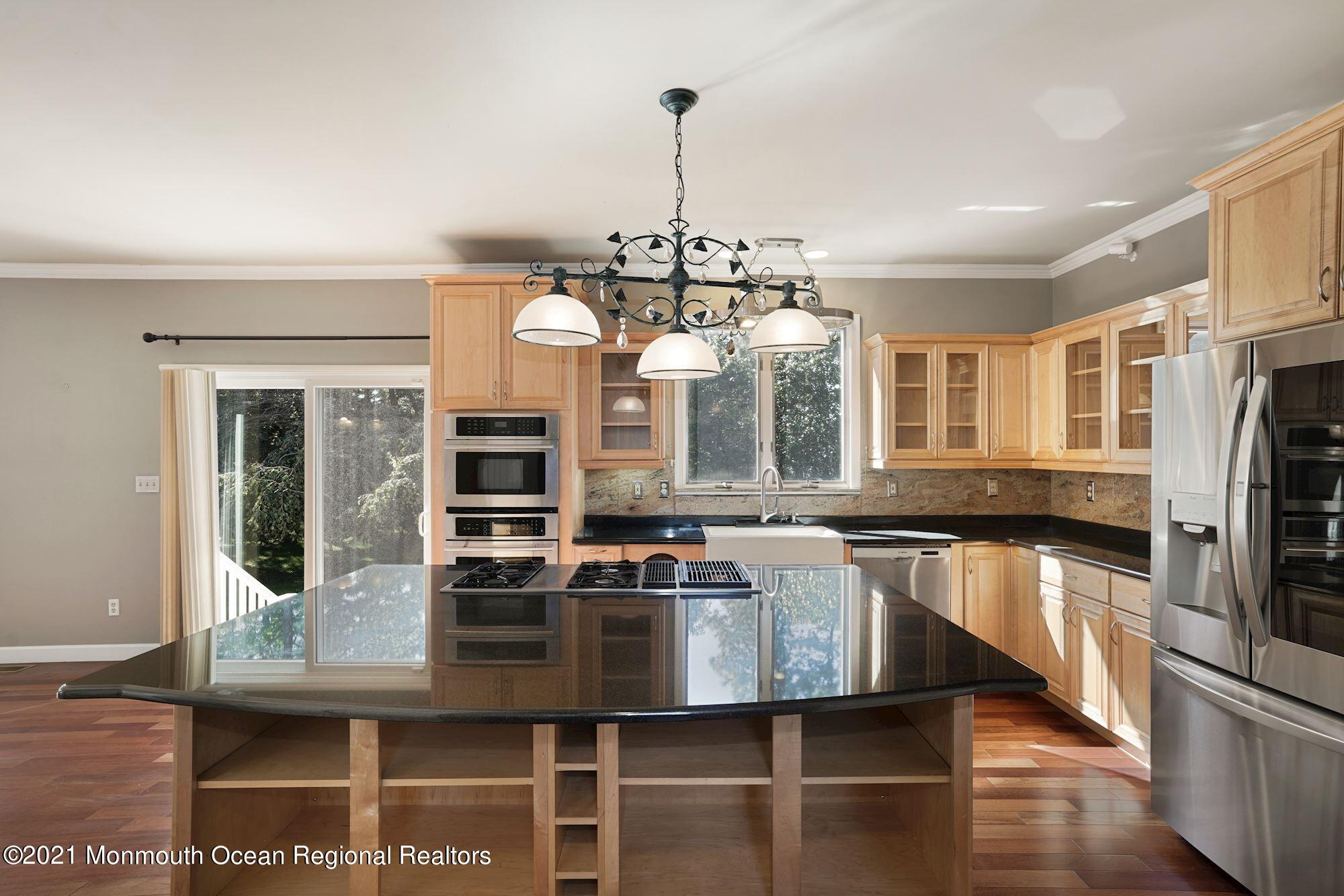 5 Roller Road Asbury Park, NJ 07712 - Photo 17 of 57 a kitchen with stainless steel appliances granite countertop a stove and a sink