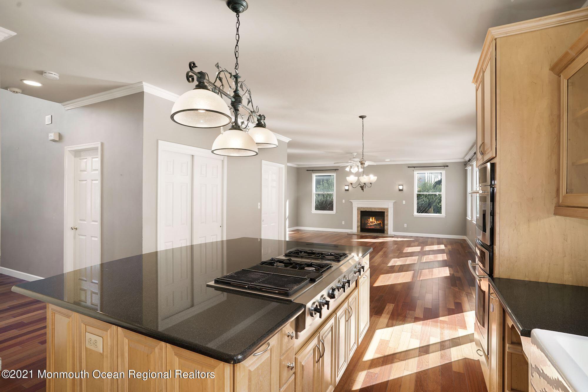 5 Roller Road Asbury Park, NJ 07712 - Photo 20 of 57 a kitchen with stove and cabinets