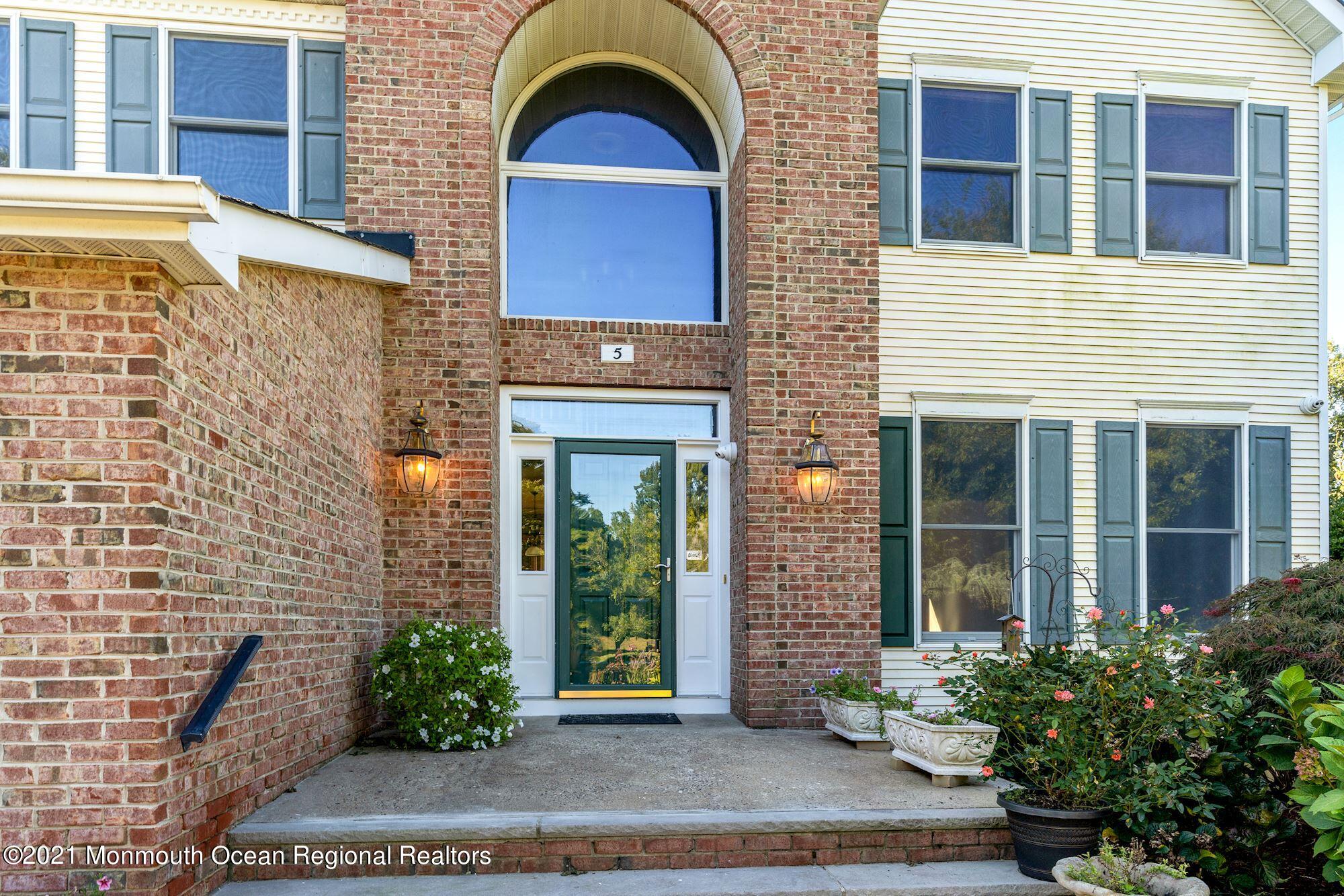 5 Roller Road Asbury Park, NJ 07712 - Photo 3 of 57 a front view of a house with a garden
