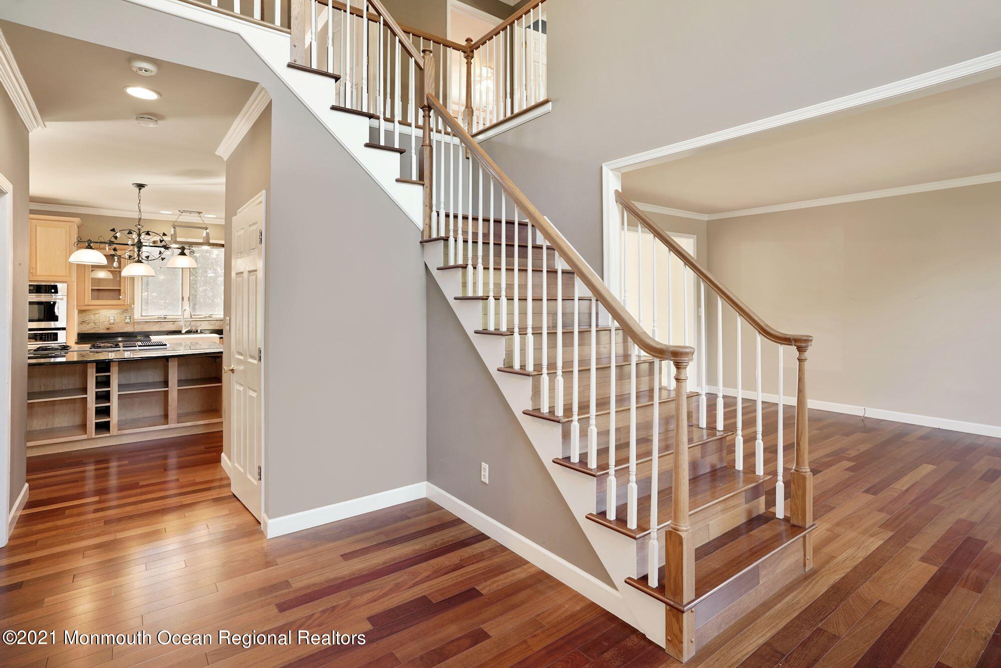 5 Roller Road Asbury Park, NJ 07712 - Photo 4 of 57 a view of entryway and hall with wooden floor