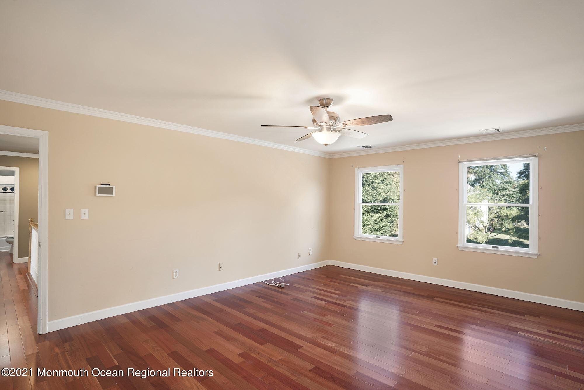 5 Roller Road Asbury Park, NJ 07712 - Photo 31 of 57 wooden floor in an empty room with a window