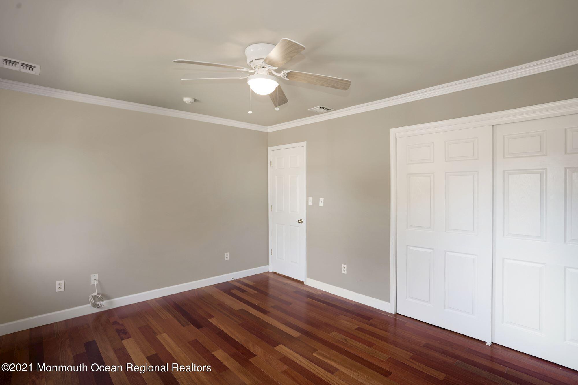 5 Roller Road Asbury Park, NJ 07712 - Photo 37 of 57 a view of an empty room with wooden floor
