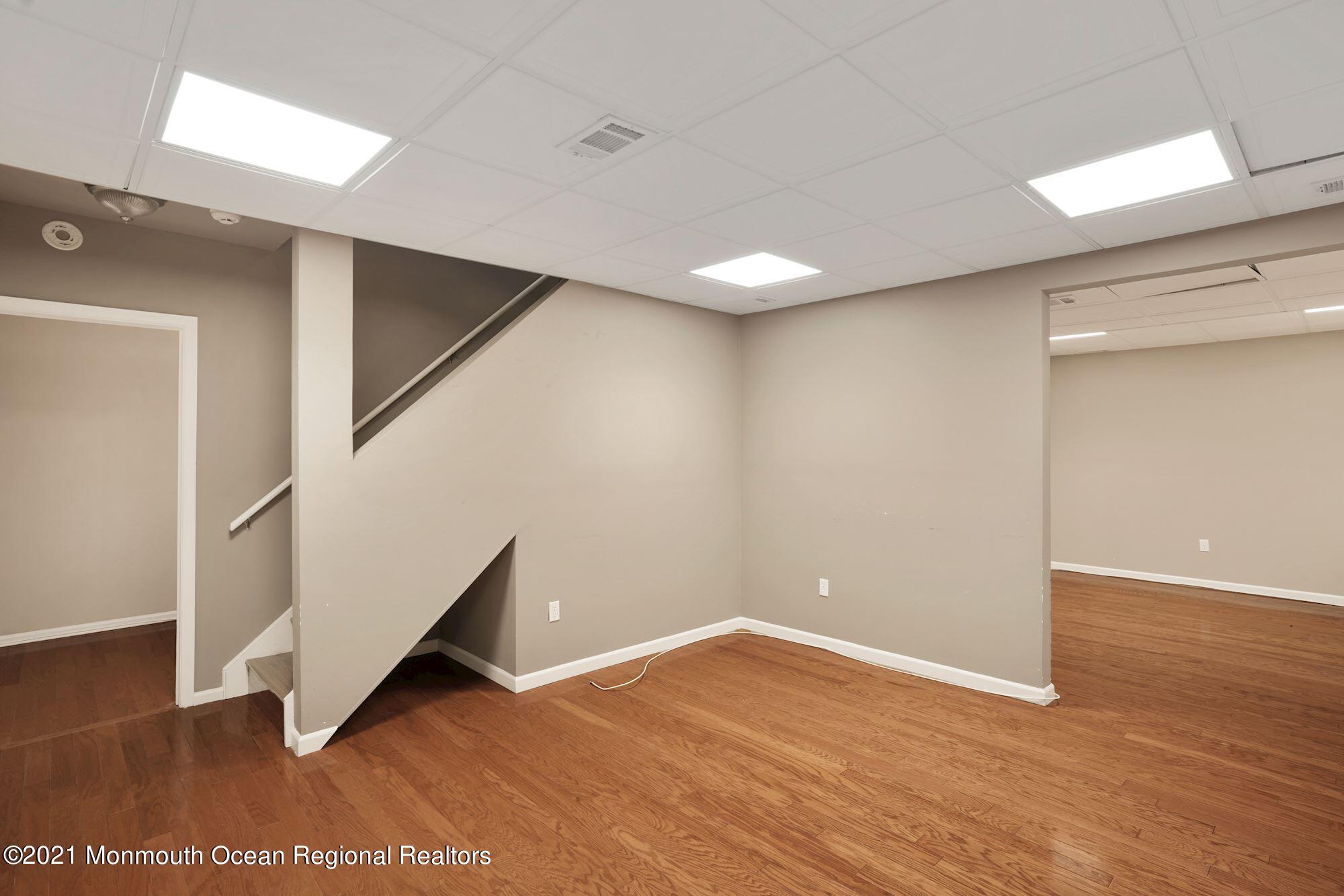 5 Roller Road Asbury Park, NJ 07712 - Photo 44 of 57 a view of an empty room with wooden floor