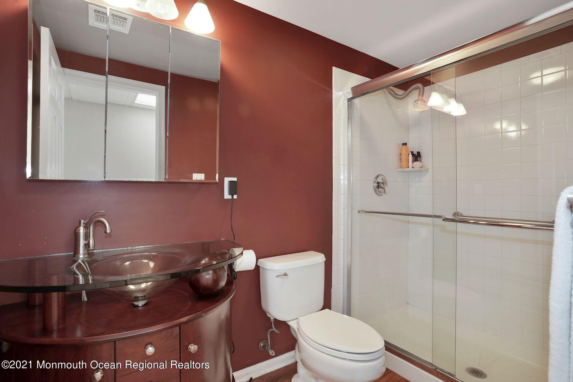 5 Roller Road Asbury Park, NJ 07712 - Photo 51 of 57 a bathroom with a toilet and a sink