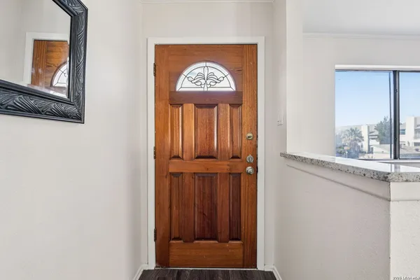 a view of entryway with wooden floor