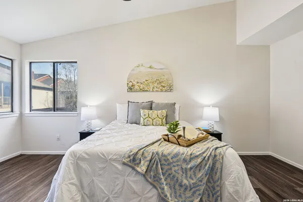 a bedroom with a bed and a window