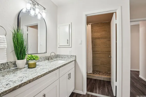 a bathroom with sink and mirror