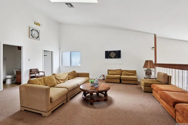 a living room with furniture and a couch