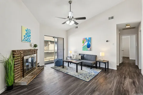 a living room with furniture and a fireplace