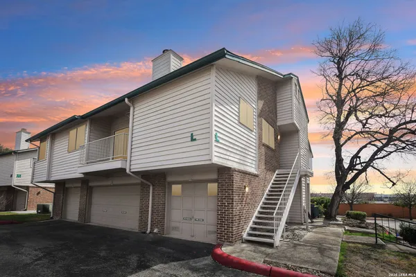 a front view of a house with stairs