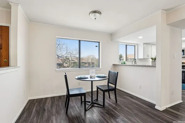 a dining room with furniture and window