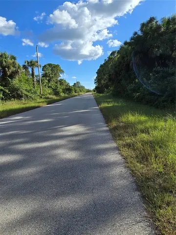 a view of a lake with a house in the background