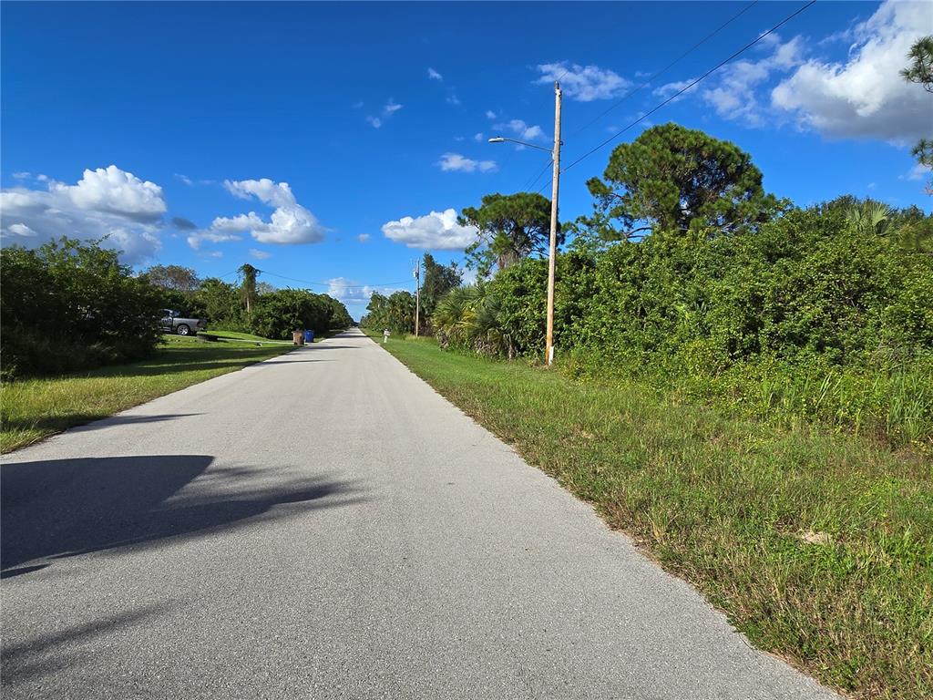 454 Naples Avenue South Lehigh Acres, FL 33974 - Photo 5 of 5 a view of a street both of side of building