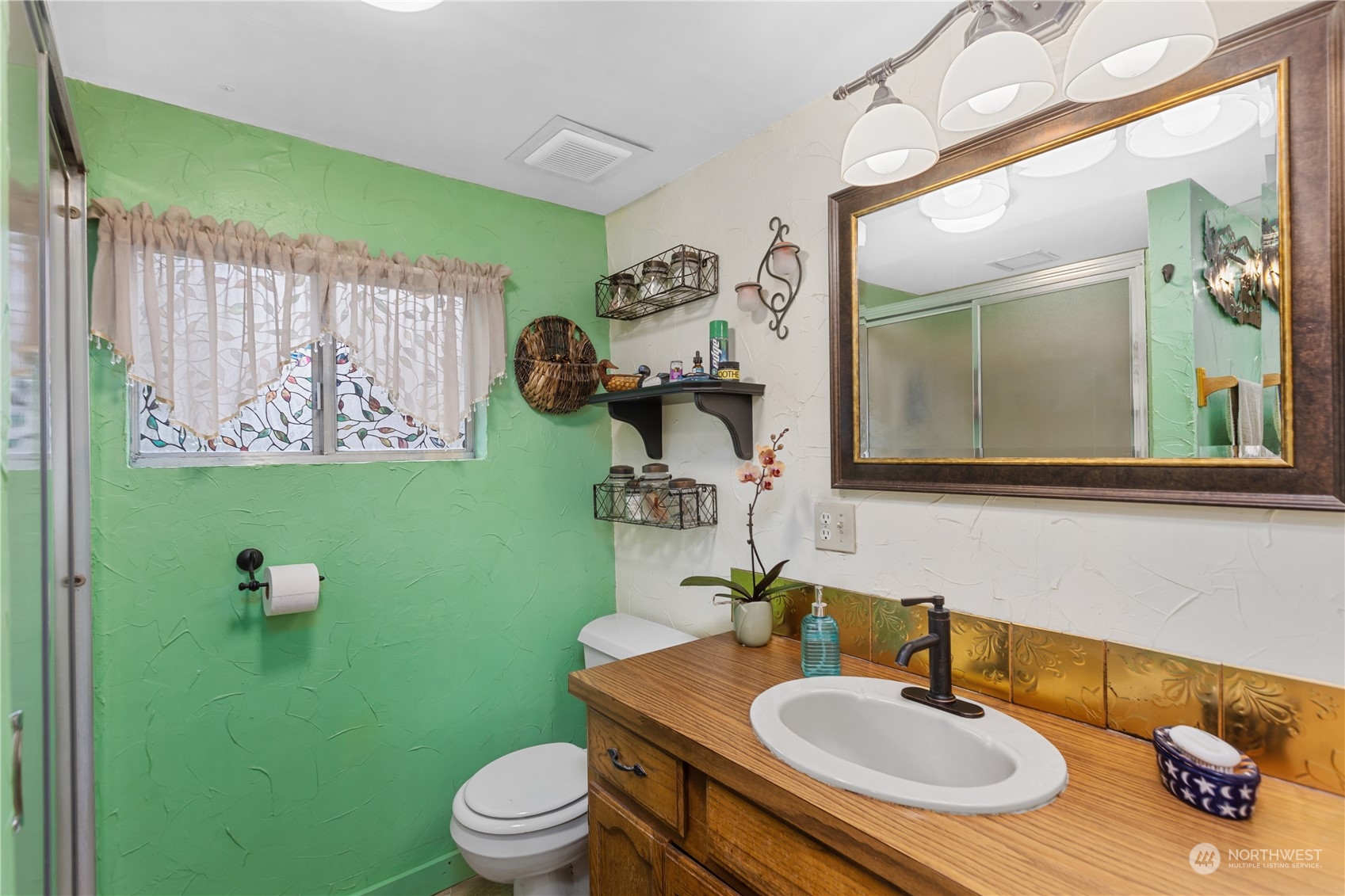 36922 Swede Heaven Road Arlington, WA 98223 - Photo 12 of 40 a bathroom with a toilet sink and mirror