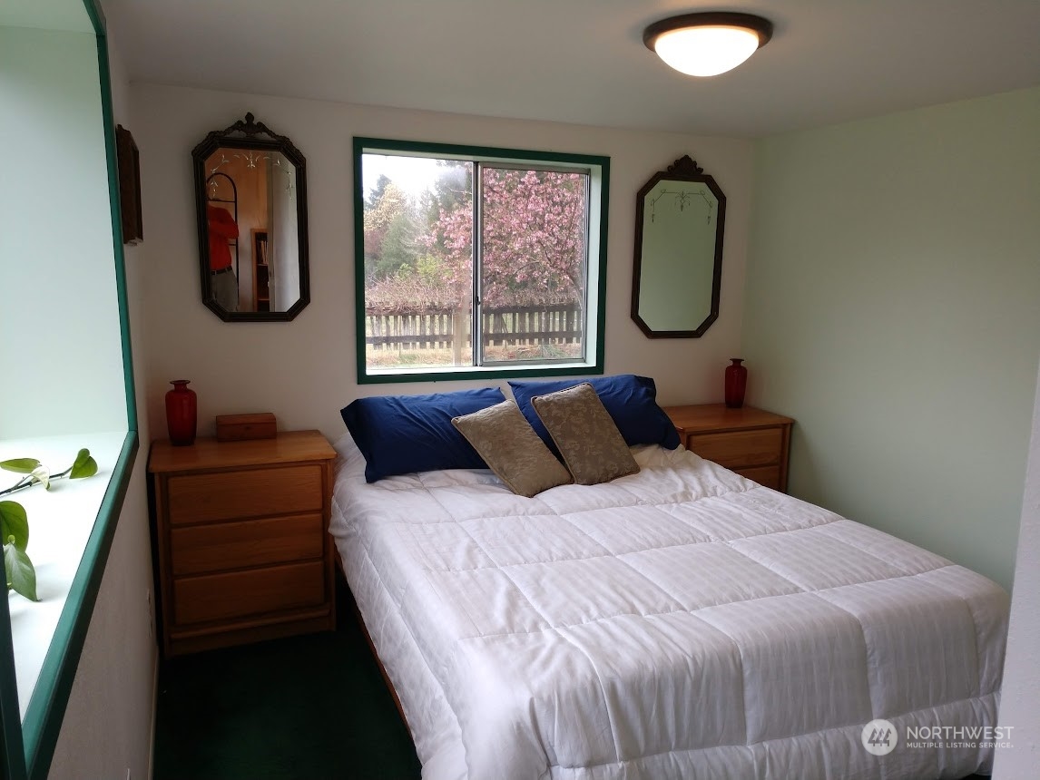 36922 Swede Heaven Road Arlington, WA 98223 - Photo 13 of 40 a bedroom with bed and window with outer view