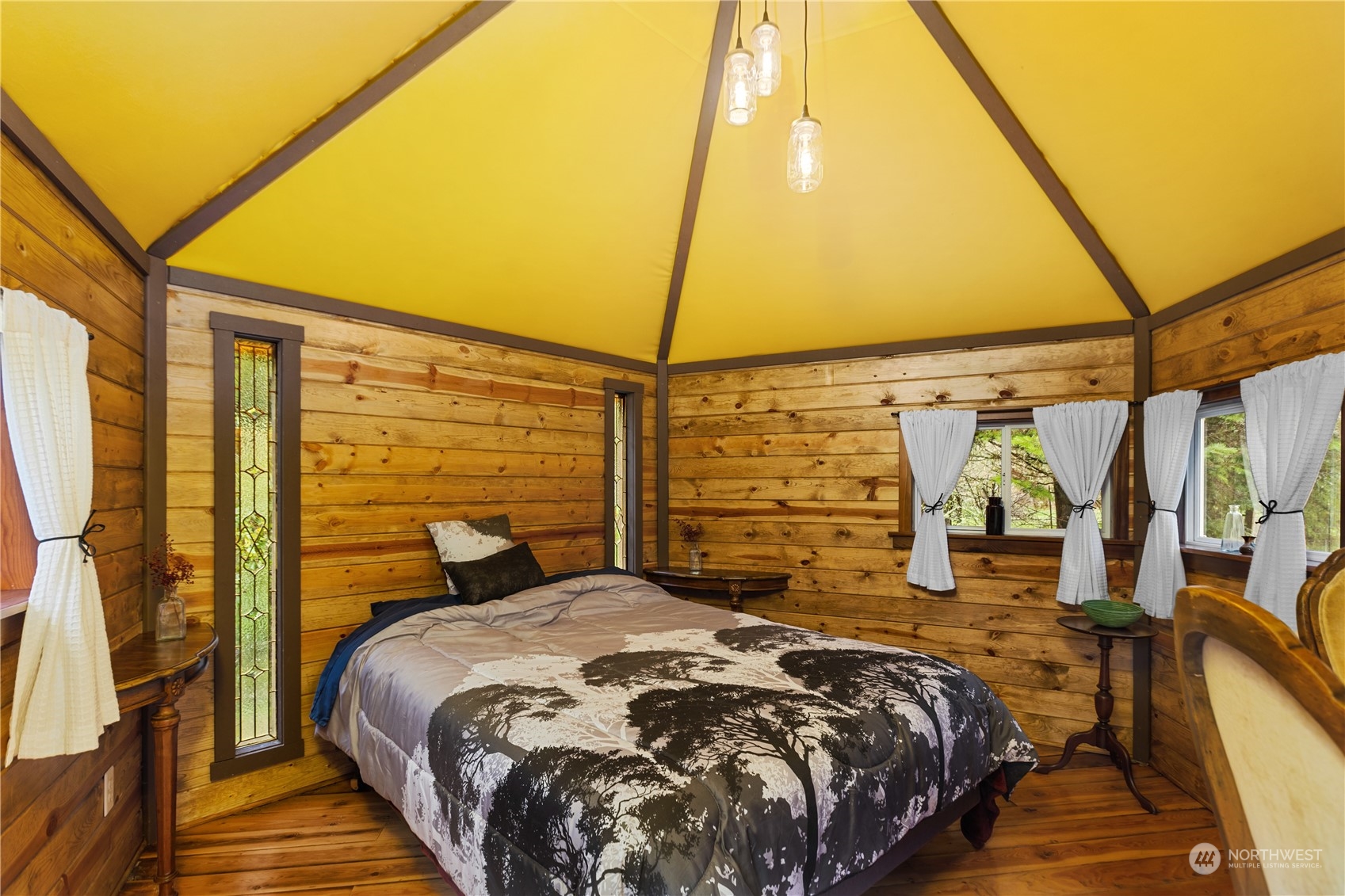 36922 Swede Heaven Road Arlington, WA 98223 - Photo 19 of 40 a bedroom with a bed and wooden floor