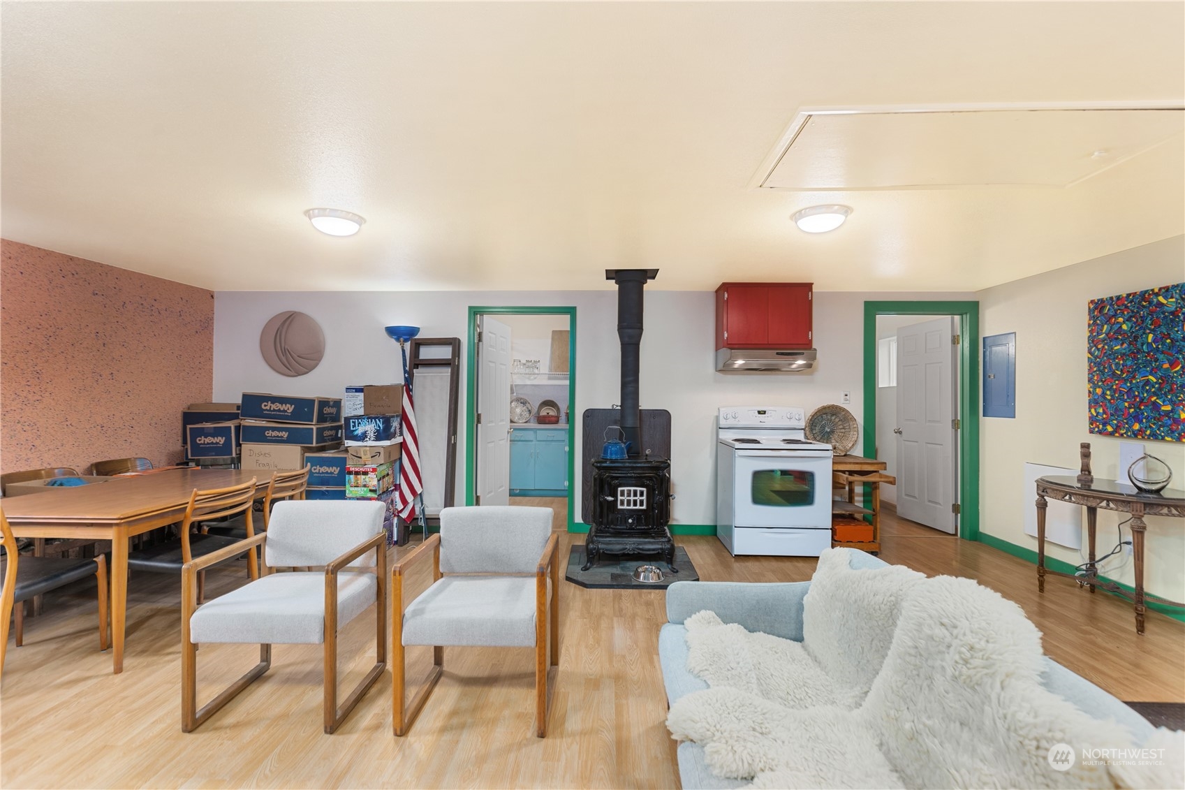 36922 Swede Heaven Road Arlington, WA 98223 - Photo 25 of 40 a living room with furniture a flat screen tv and a fireplace