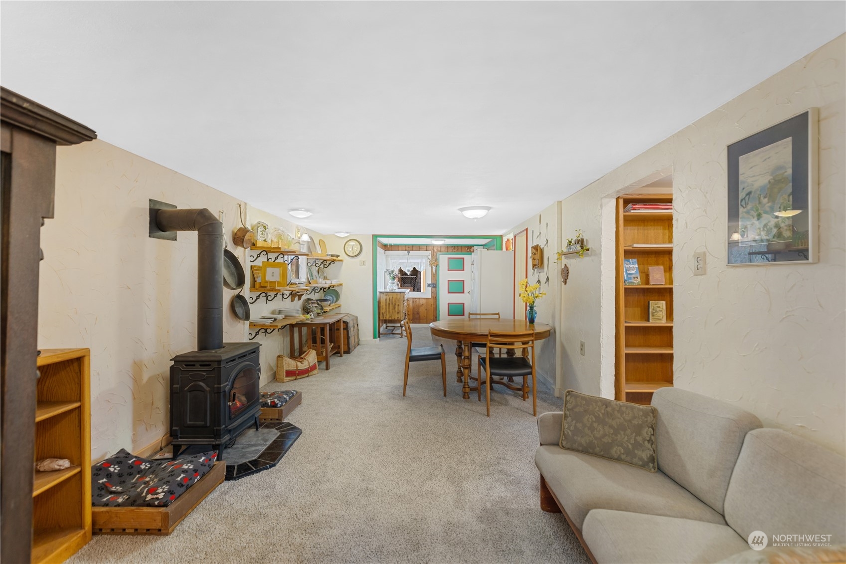 36922 Swede Heaven Road Arlington, WA 98223 - Photo 5 of 40 a living room with furniture a flat screen tv and gym equipment