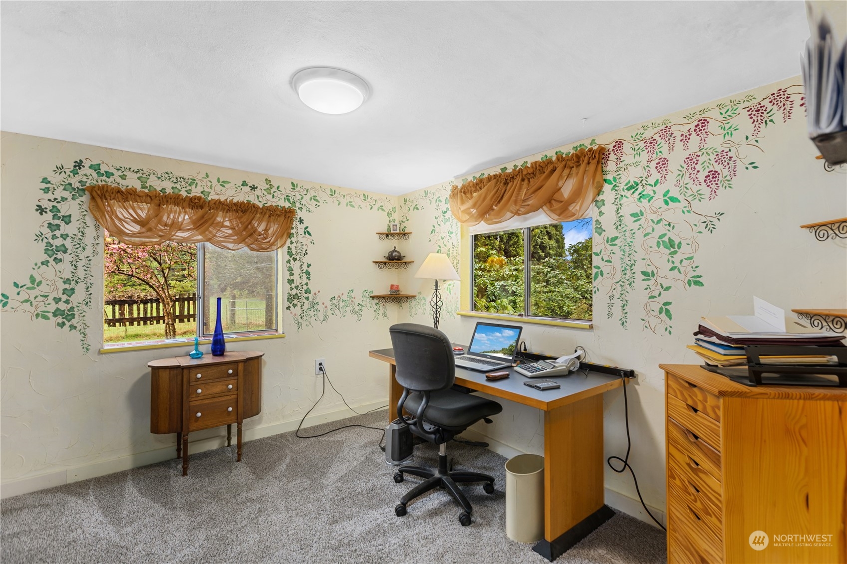 36922 Swede Heaven Road Arlington, WA 98223 - Photo 7 of 40 a view of a workspace with furniture and a window