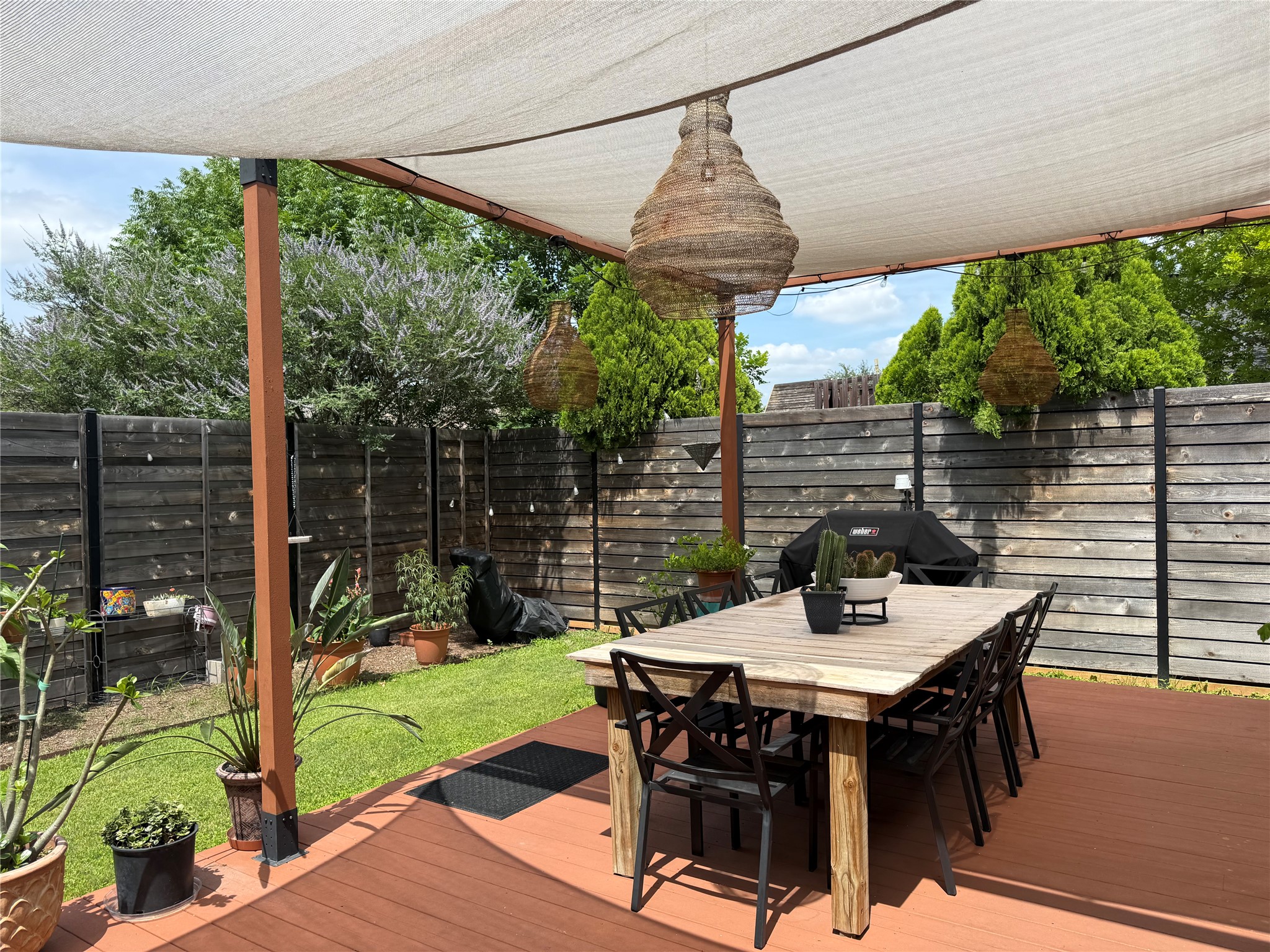 7108 Hester Road Austin, TX 78725 - Photo 15 of 25 a table and chairs in front of a yard
