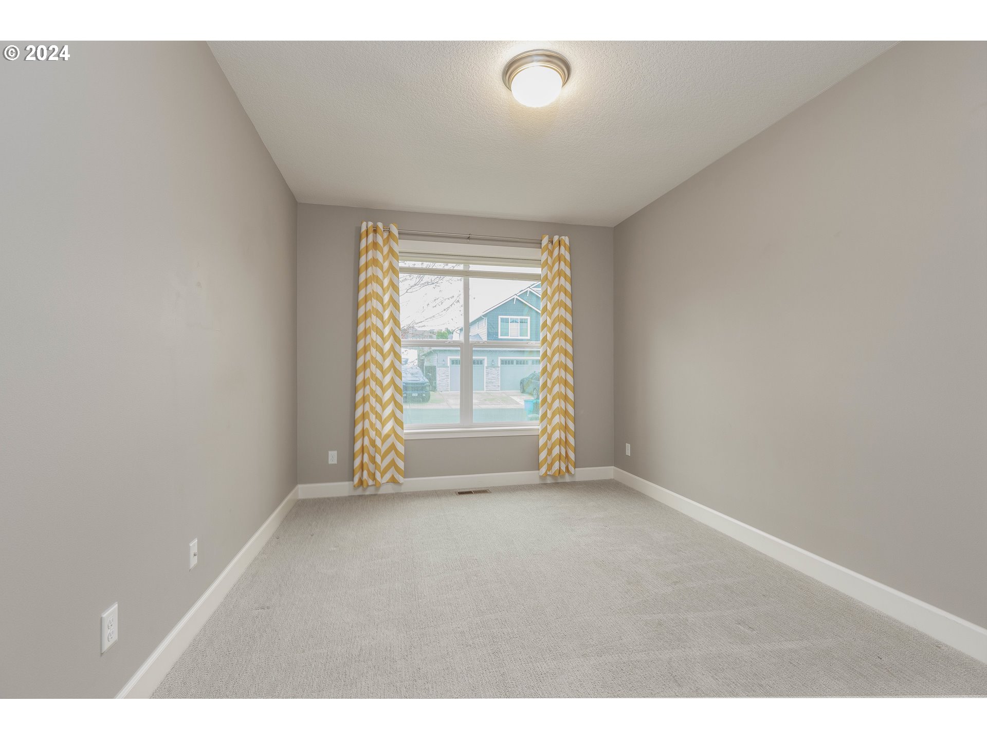 2714 Northeast 167th Circle Ridgefield, WA 98642 - Photo 24 of 35 a view of an empty room with a window