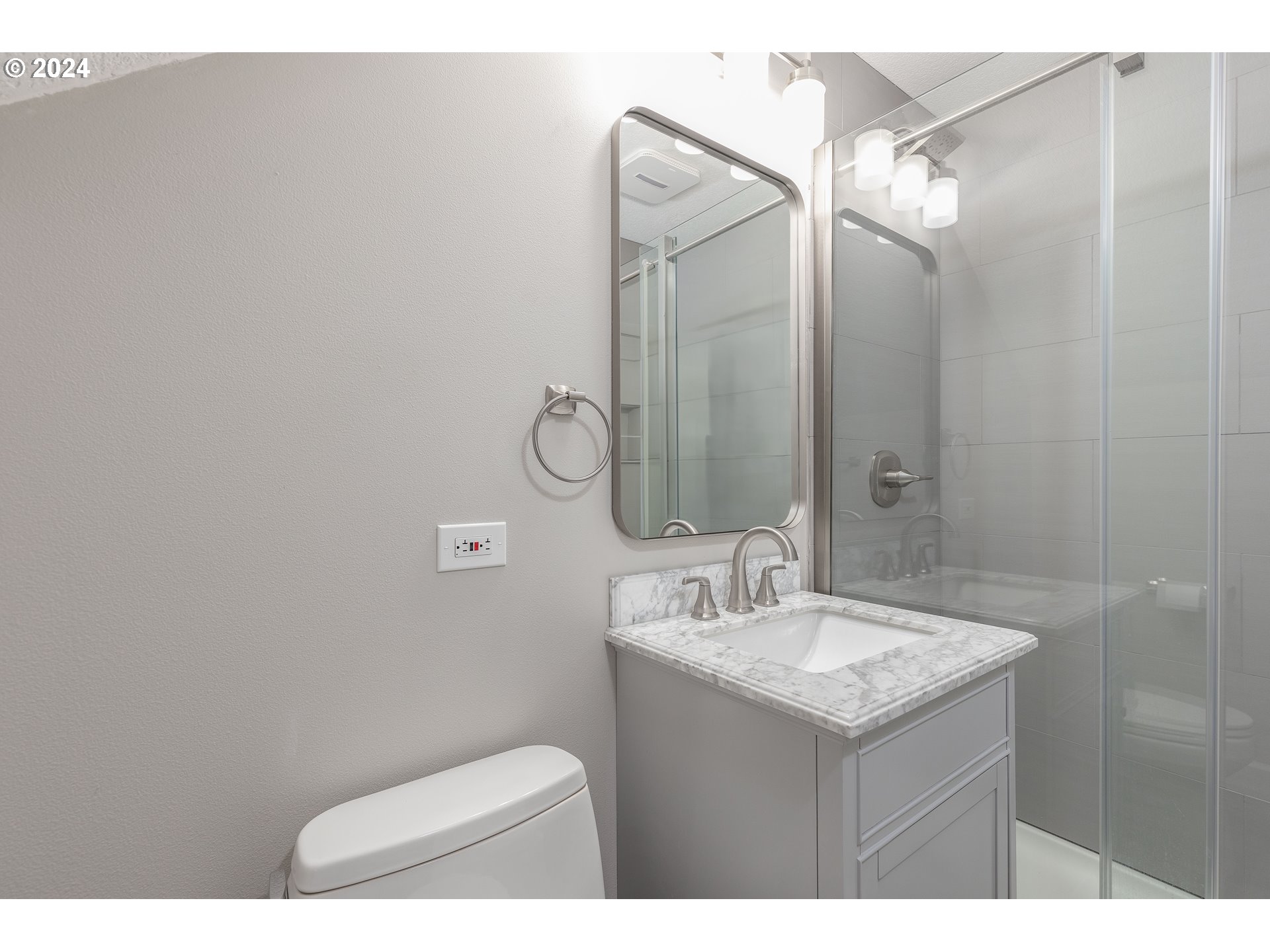 2714 Northeast 167th Circle Ridgefield, WA 98642 - Photo 28 of 35 a bathroom with a sink mirror and toilet