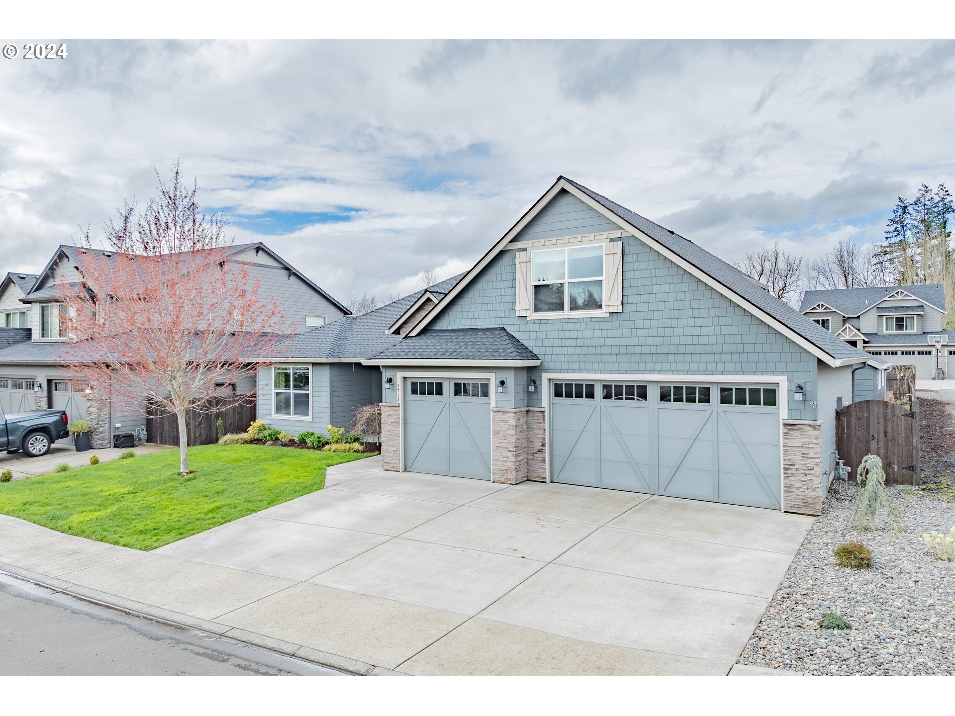 2714 Northeast 167th Circle Ridgefield, WA 98642 - Photo 35 of 35 a view of a big house with a big yard and large tree