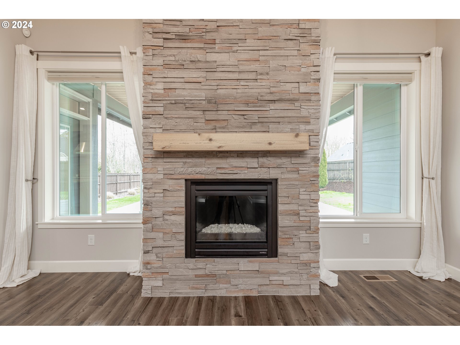 2714 Northeast 167th Circle Ridgefield, WA 98642 - Photo 5 of 35 a living room with a fireplace