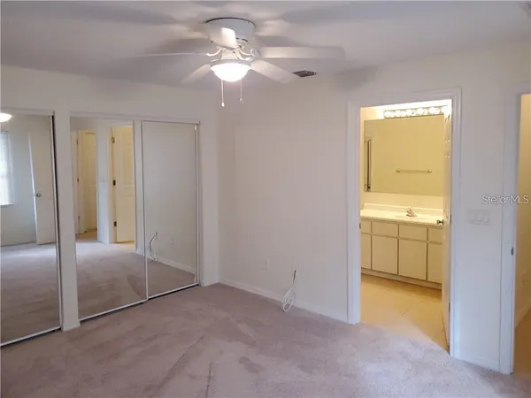 a kitchen with a sink a stove and cabinets