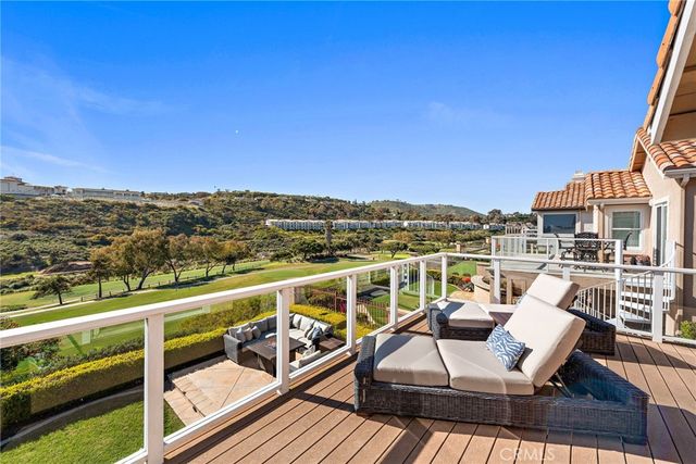 a view of a balcony with furniture