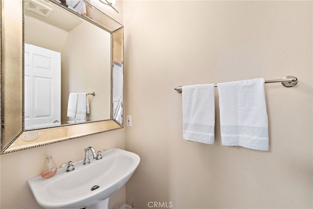 a bathroom with a sink and mirror