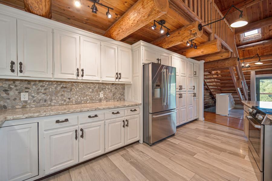5000 Reservation Road Placerville, CA 95667 - Photo 20 of 85 a kitchen with cabinets and stainless steel appliances