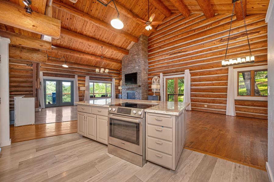 5000 Reservation Road Placerville, CA 95667 - Photo 21 of 85 a kitchen with stainless steel appliances granite countertop a stove and cabinets with wooden floor
