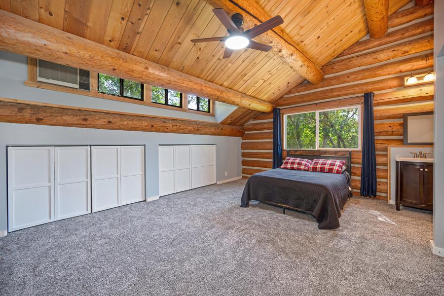 5000 Reservation Road Placerville, CA 95667 - Photo 28 of 85 a spacious bedroom with a bed and a large window