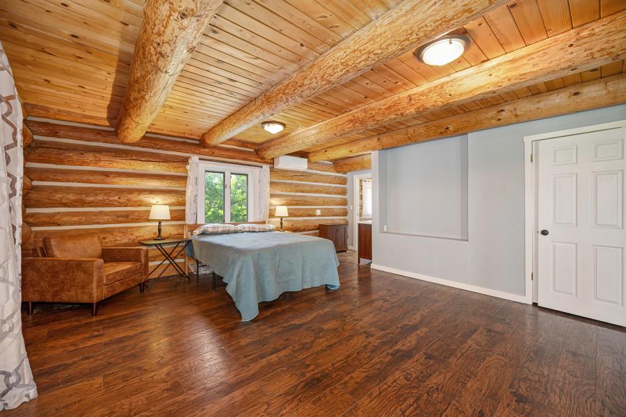 5000 Reservation Road Placerville, CA 95667 - Photo 50 of 85 a bedroom with a bed and wooden floor