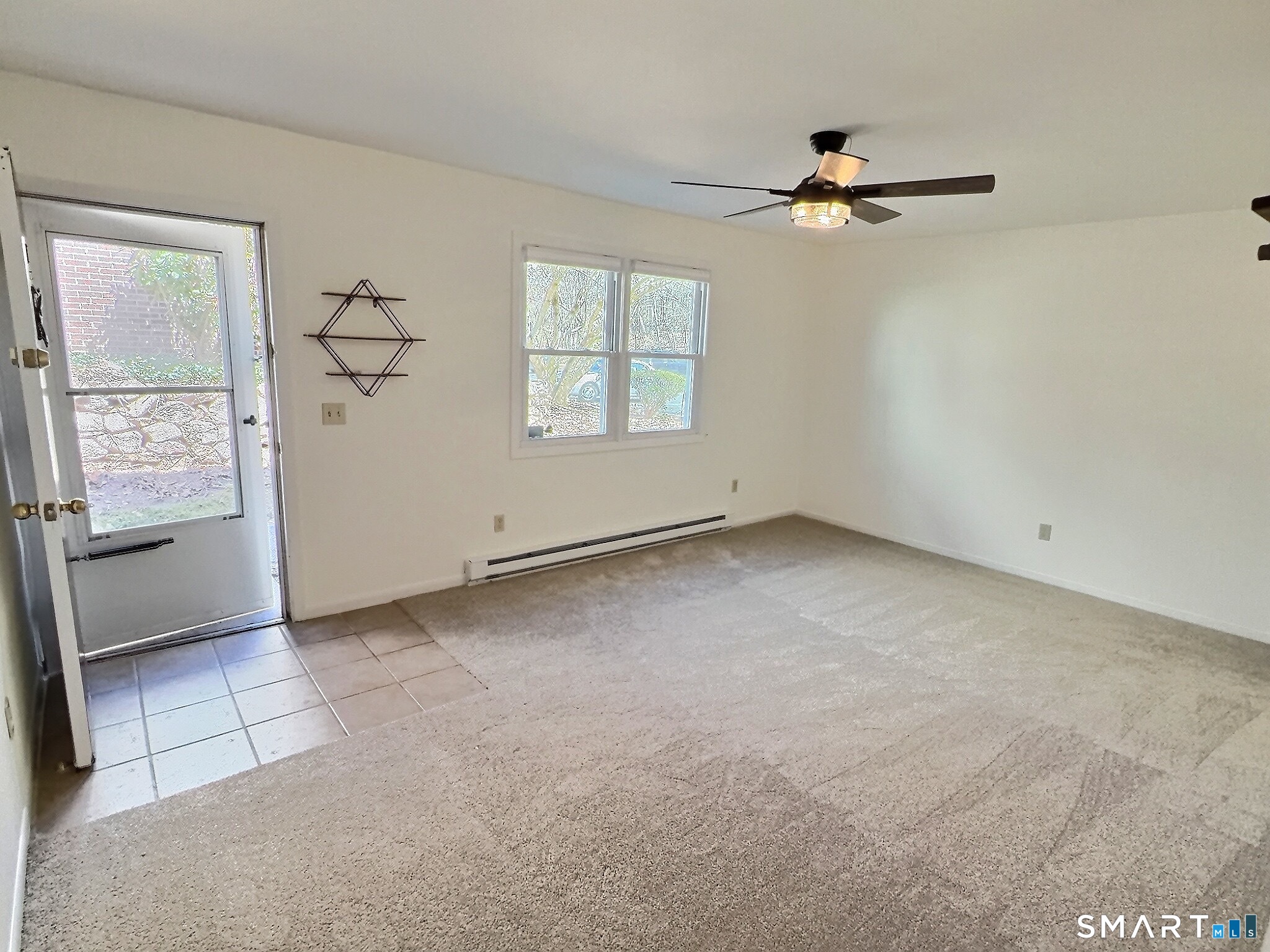 61 Dover Court, Unit B Branford, CT 06405 - Photo 2 of 14 a view of an empty room with a window
