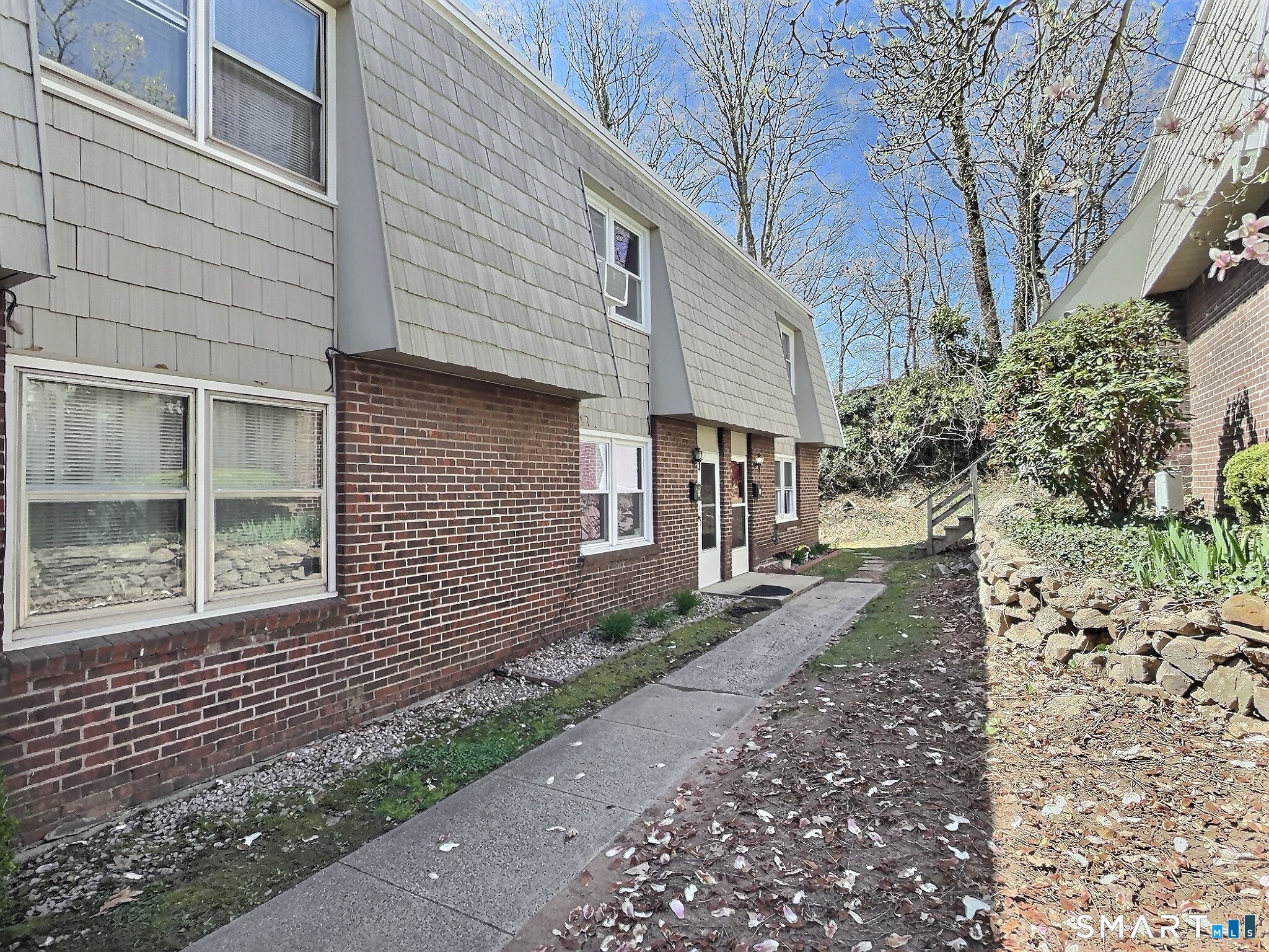 61 Dover Court, Unit B Branford, CT 06405 - Photo 6 of 14 a front view of a house with garden