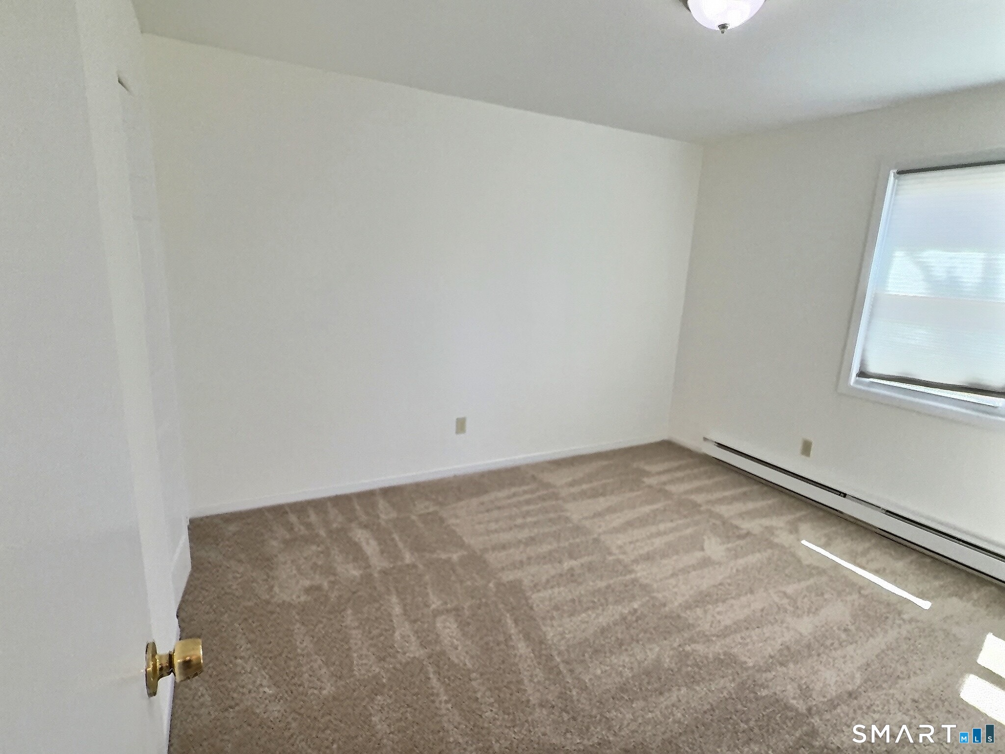 61 Dover Court, Unit B Branford, CT 06405 - Photo 8 of 14 a view of a room with a window