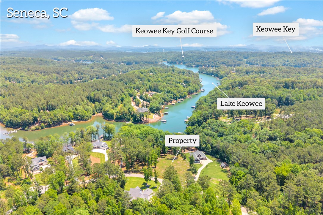 Lot 60 Harbor Point Seneca, SC 29672 - Photo 9 of 30 An aerial panorama reveals a vast forest, sparkling lake, and surrounding mountains.