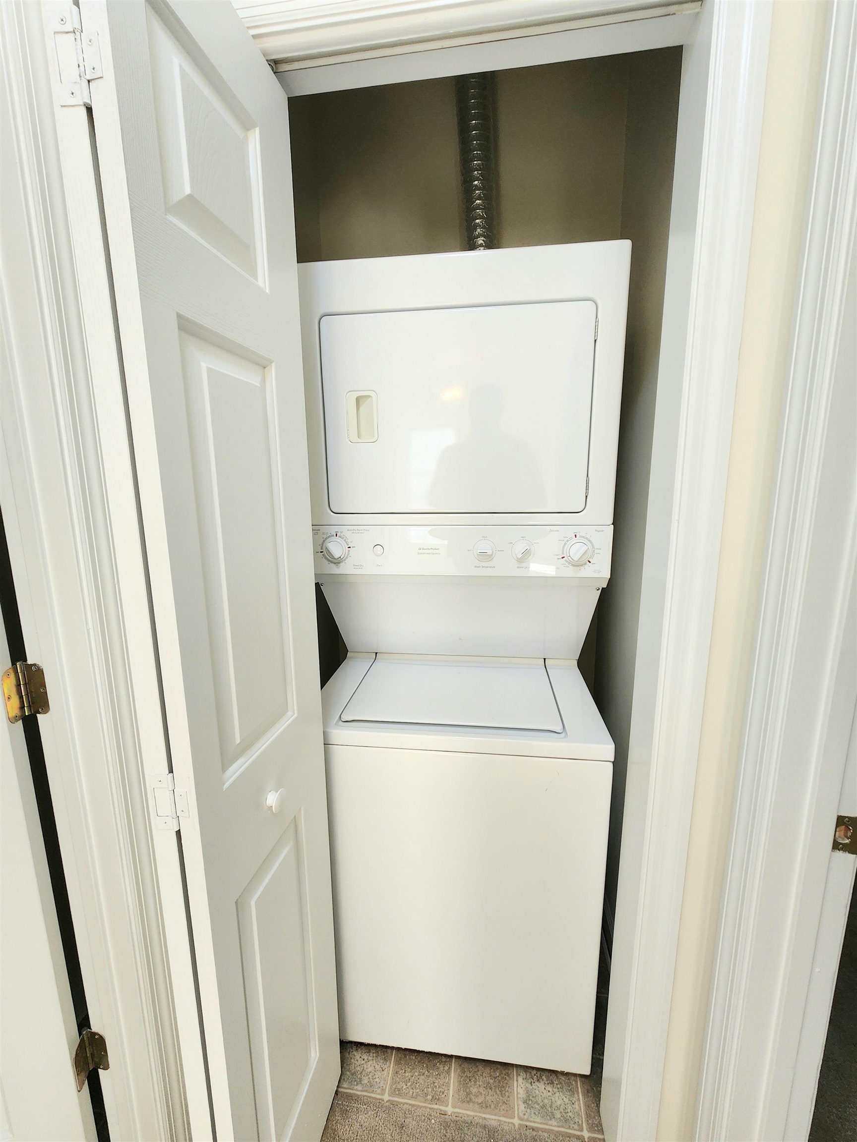 2080 Cross Gate Boulevard, Unit 105 Myrtle Beach, SC 29575 - Photo 17 of 25 Laundry room with estacked washer and dryer