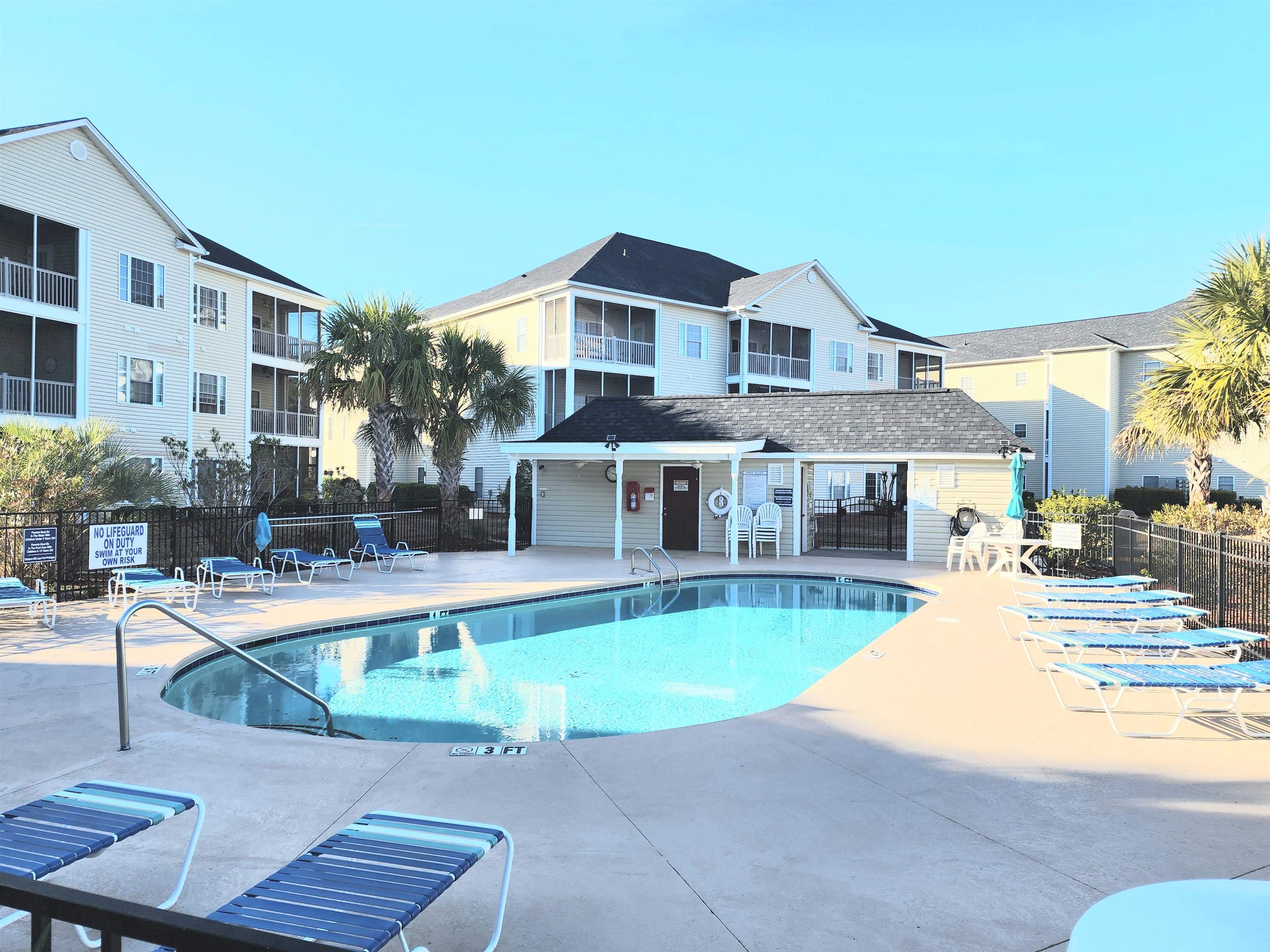 2080 Cross Gate Boulevard, Unit 105 Myrtle Beach, SC 29575 - Photo 8 of 25 Community pool featuring a patio area