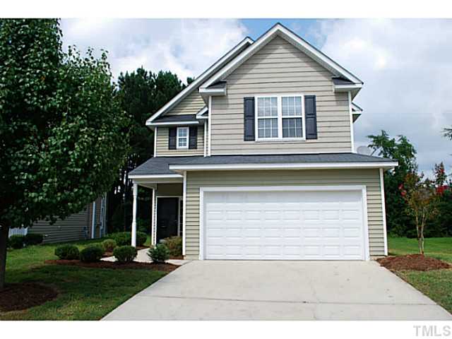 3117 Rendezvous Drive Raleigh, NC 27610 - Photo 1 of 22 a front view of a house with a yard and garage
