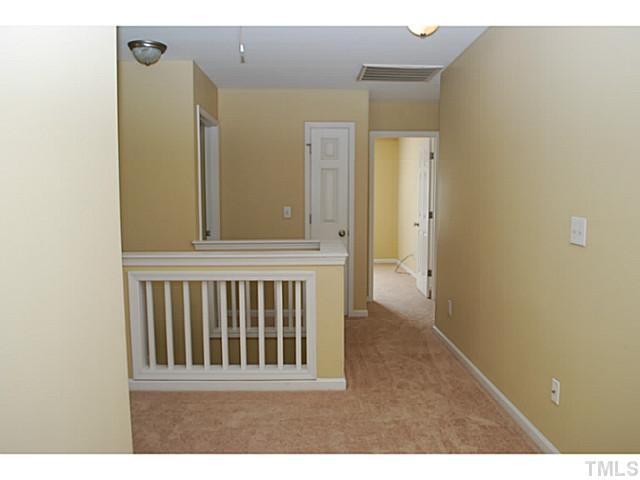 3117 Rendezvous Drive Raleigh, NC 27610 - Photo 14 of 22 a view of a hallway with wooden floor