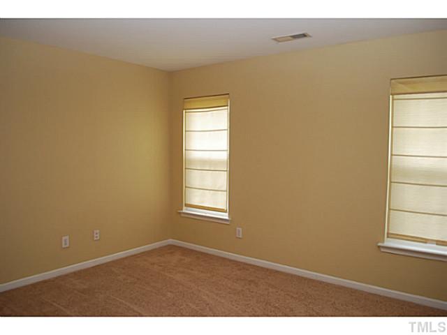 3117 Rendezvous Drive Raleigh, NC 27610 - Photo 15 of 22 a view of empty room with windows
