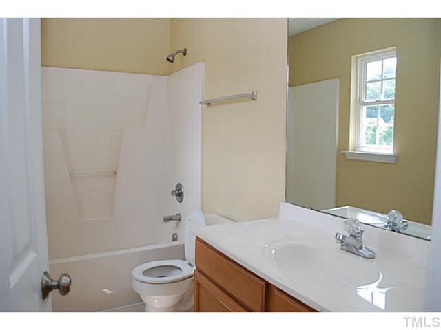 3117 Rendezvous Drive Raleigh, NC 27610 - Photo 18 of 22 a bathroom with a sink a toilet and shower