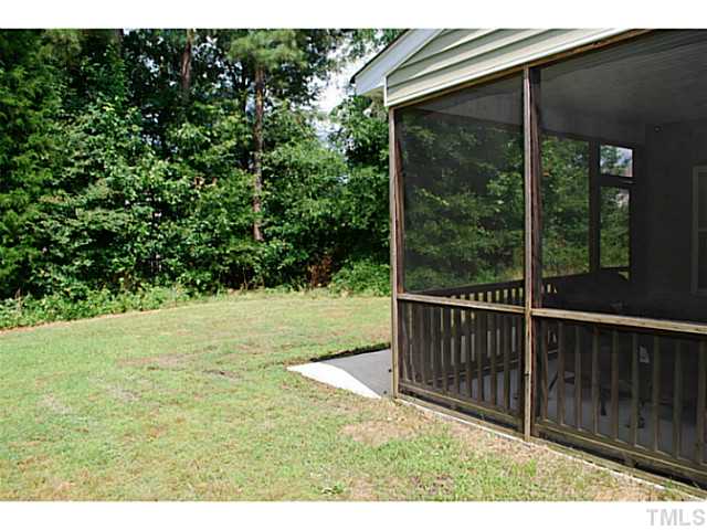 3117 Rendezvous Drive Raleigh, NC 27610 - Photo 21 of 22 a view of a backyard with a garden