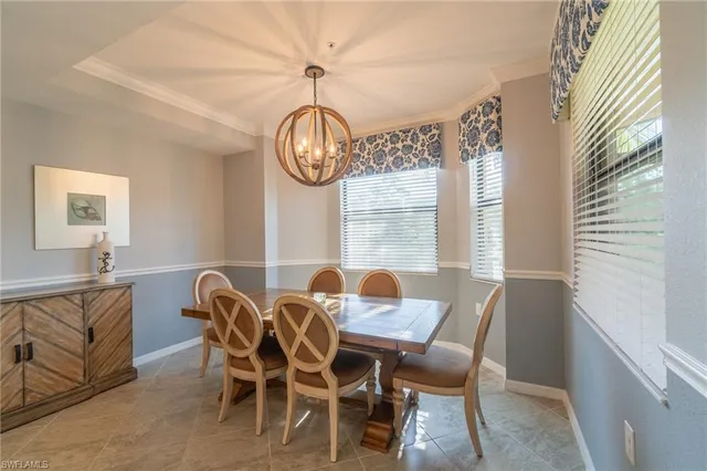 a view of a dining room with furniture window and chandelier
