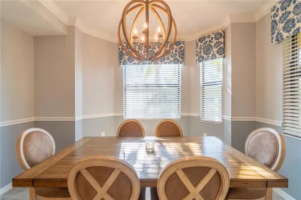a dining room with furniture and window