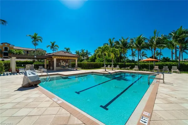 an aerial view of a house with outdoor space swimming pool