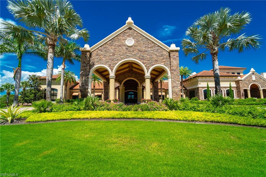 9590 Trevi Court, Unit 5317 Naples, FL 34113 - Photo 25 of 38 a front view of a house with a yard